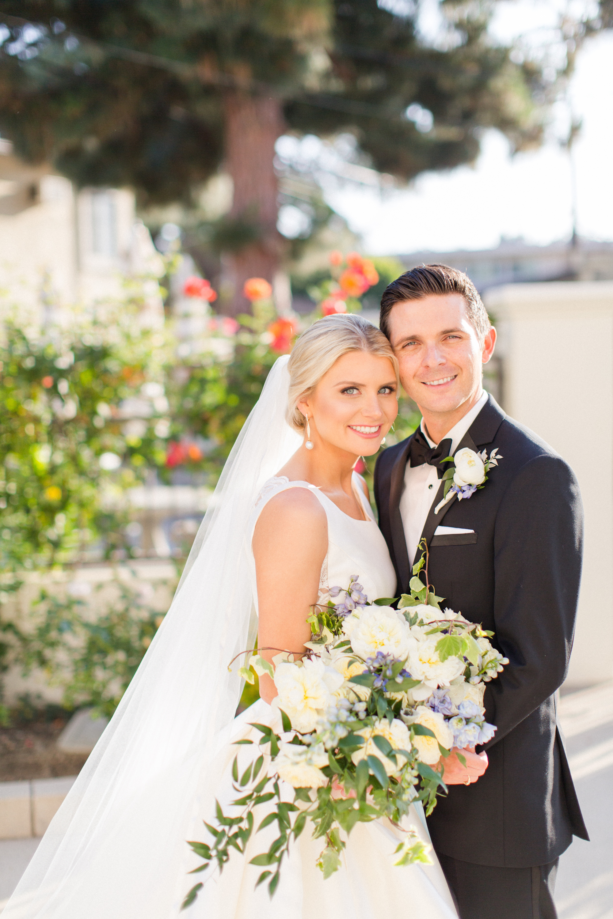 bride and groom smile