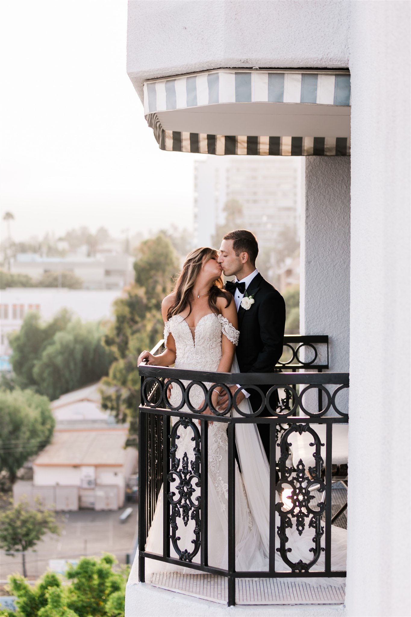 bride and groom on balcony
